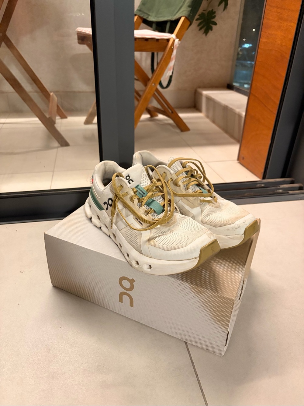 On Running Womens White and Green Sneakers with Gold Accents